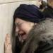 A woman cries at Lubyanka metro station in Moscow 